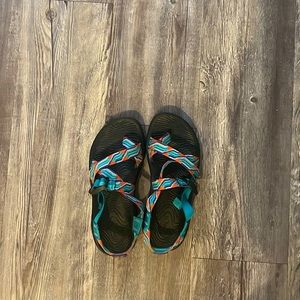 Blue, orange, and purple women’s Chacos